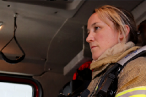 Female Firefighter in Cab