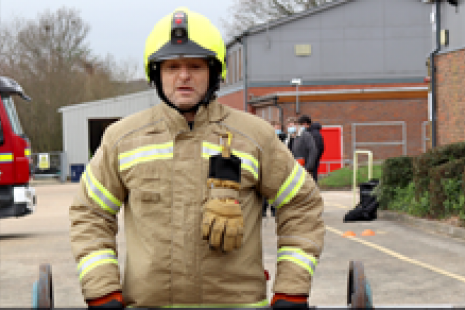 Male Firefighter Lifting Weights